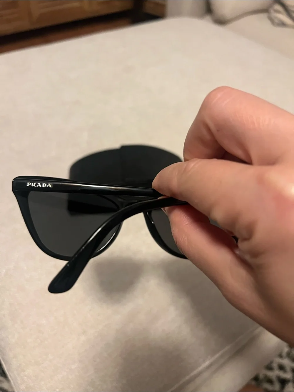 Prada Black Cat-Eye Sunglasses with Dark Lenses